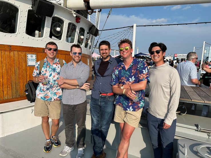 Group photo of several ezCaterers enjoying themselves on the Tall Ship.