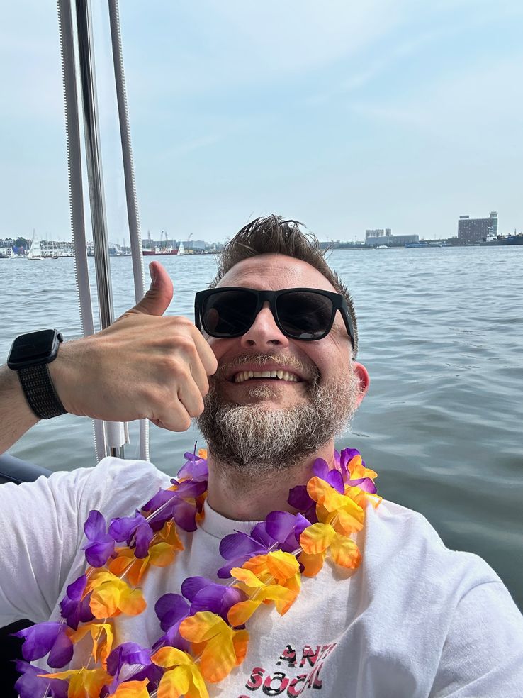 Me, on the boat, giving the thumbs up to a good trip on the water.