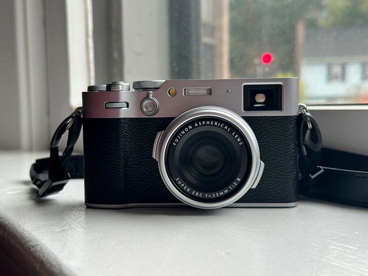 Fujifilm X100VI camera sitting on my window ledge, backlit by muted sunlight