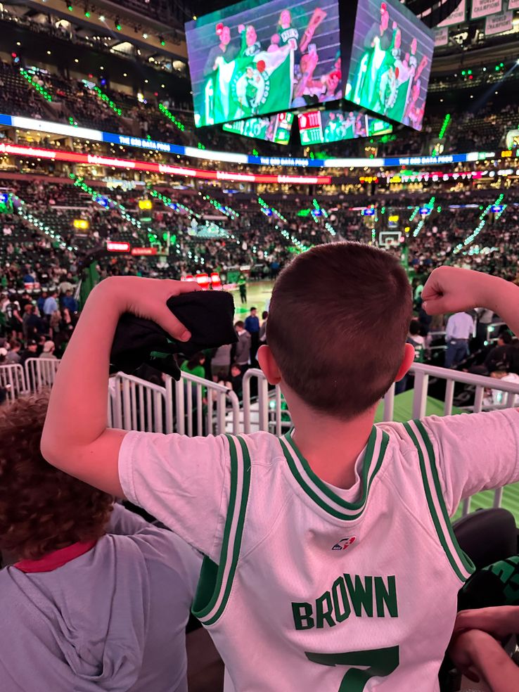 G flexing in his JB jersey, at the Celtics game